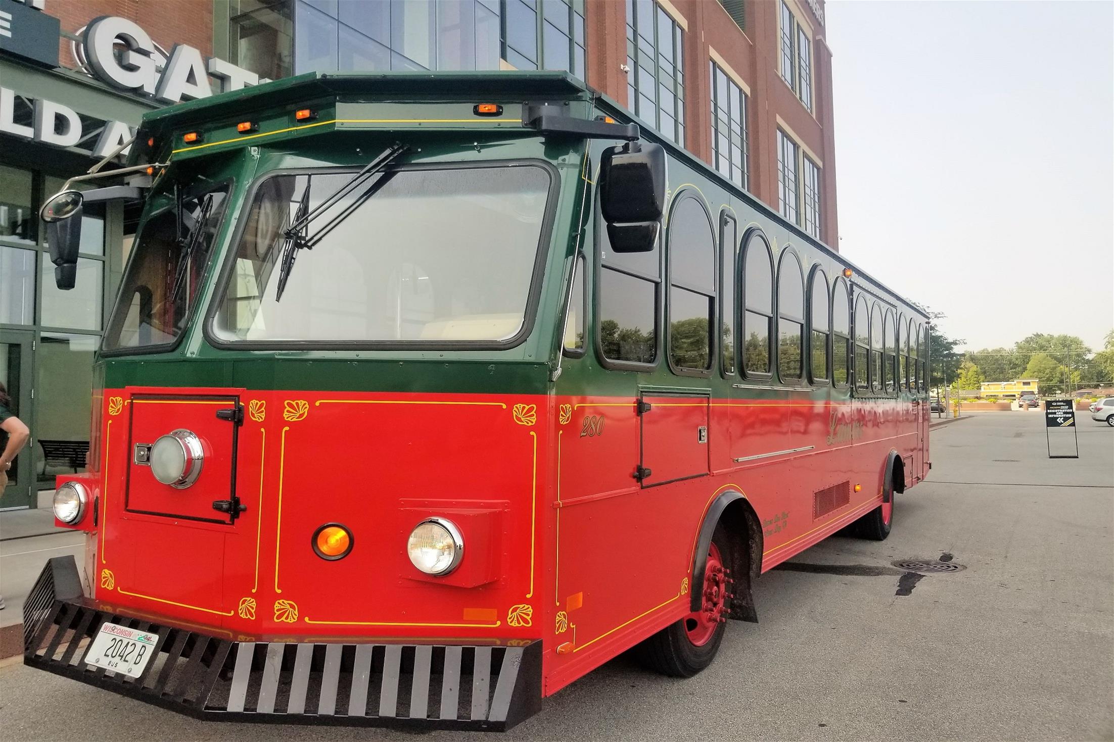 Trolley parked in front of the American Family Gate at Lambeau Field.